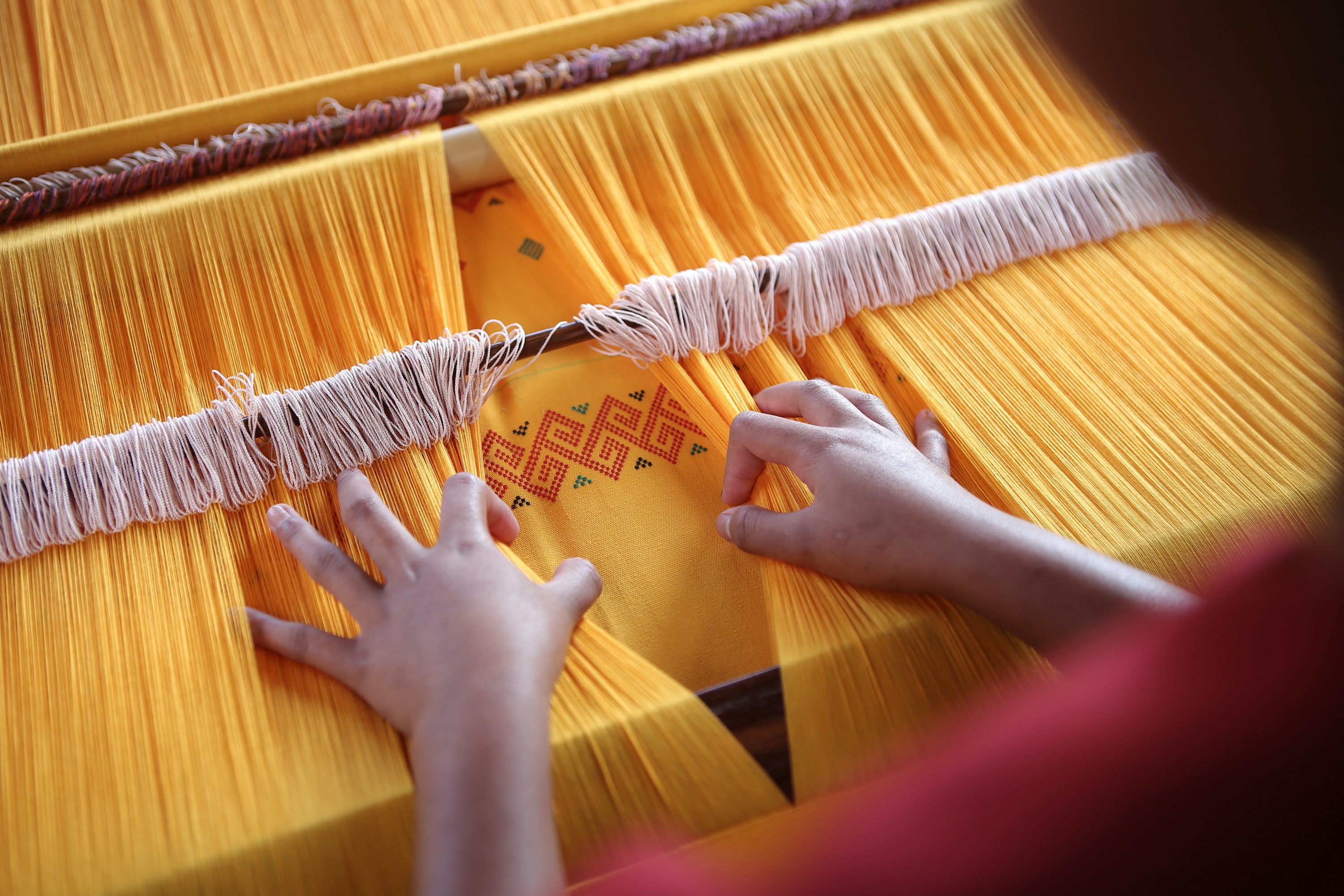 Close-up of woven fabric on a loom
